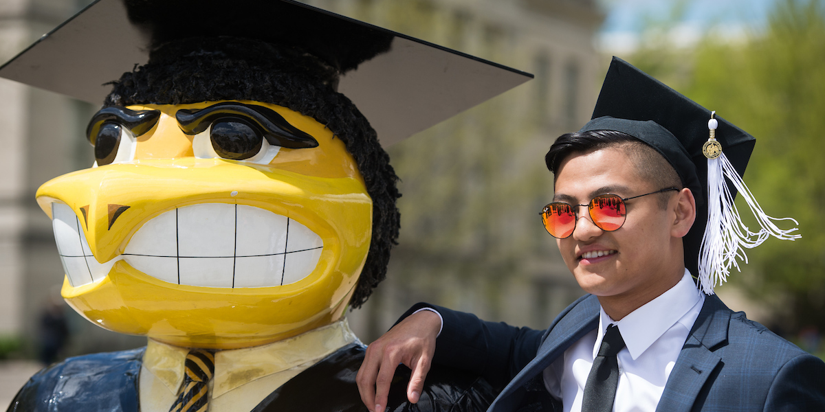 Student poses with Herky